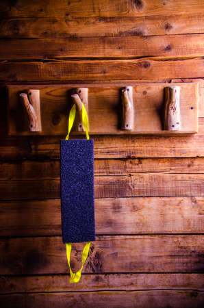 washcloths hanging on wooden hooks. Sponge for washing on a hangerの写真素材