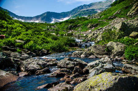 fast mountain waterfall with clear spring water. beautiful viewの写真素材