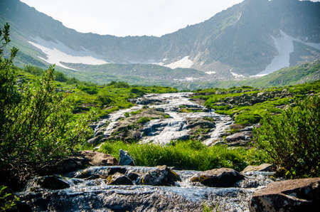 fast mountain waterfall with clear spring water. beautiful viewの写真素材
