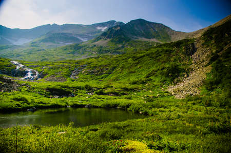 picturesque lake on top of the mountain. Beautiful summer landscape.の写真素材
