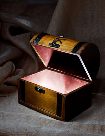 Wooden chest with light from inside.の写真素材