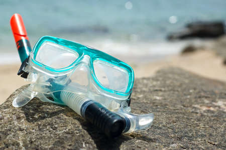 Snorkel and mask on the beach.