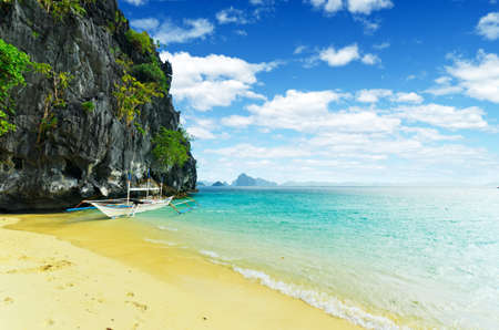 Tropical sea landscape. Boat on the beach.の写真素材