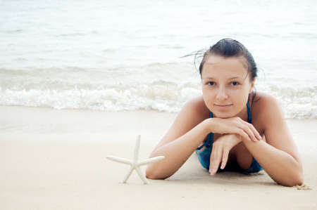 Young woman on the beach.の写真素材