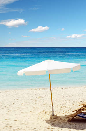 Chairs on white sand beach.の写真素材
