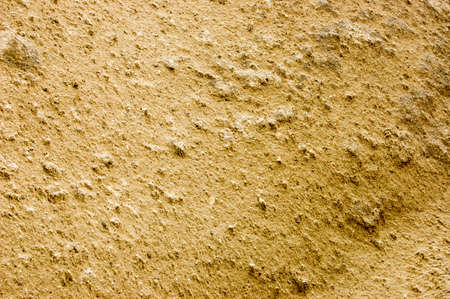 Yellow tufa. Stone texture. Close-up.の写真素材