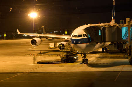 commercial airplane loading. night scene.の写真素材
