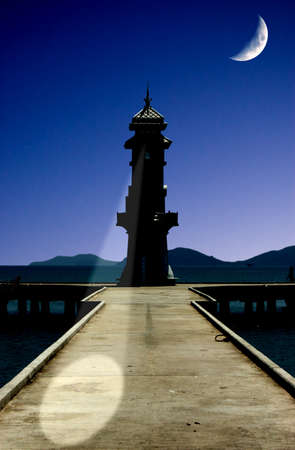 night lighthouse and beautiful moon の写真素材