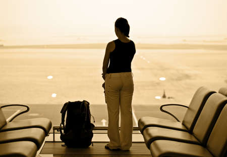 Young woman in airport lobby.の写真素材