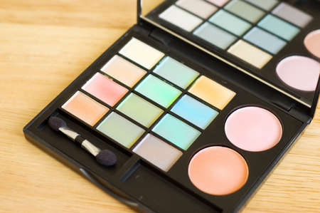 eyeshadow palette on wood backgroundの写真素材