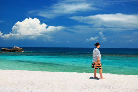 Young caucasian woman on tropical beach.の写真素材