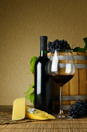 wine and cheese on the tableの写真素材