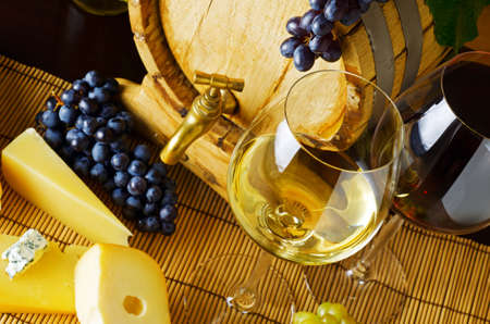 wine and cheese on the tableの写真素材