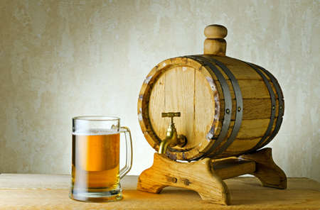 Beer and barrel on the wood table.の写真素材