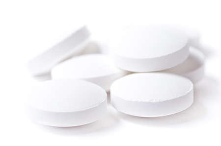 White pills on white background. Shallow DOF.の写真素材