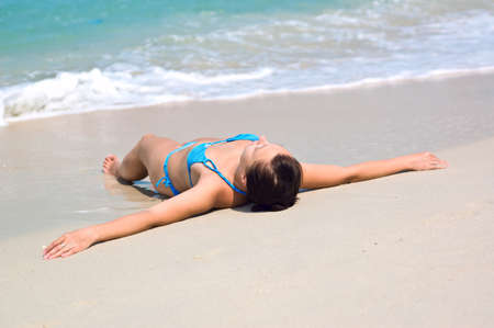 Young woman on the beach.の写真素材