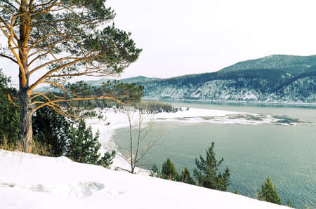 Winter landscape. Mountains and river.