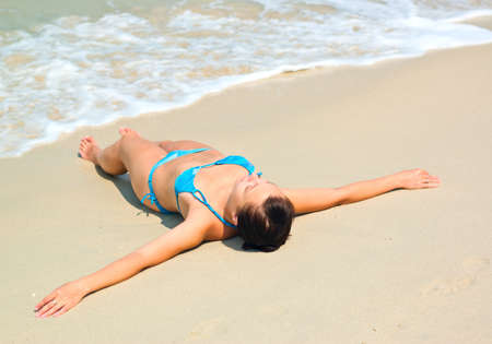 Young woman on the beach.の写真素材