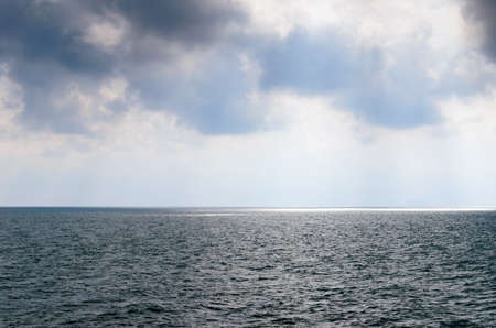 Rainy sky over the grey sea,.の写真素材