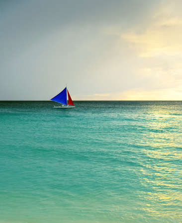 Sunset  landscape. Sailboat on coast of Boracay island.の写真素材