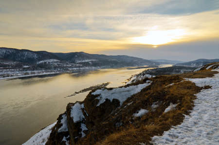 Winter landscape. Mountains and river.の写真素材