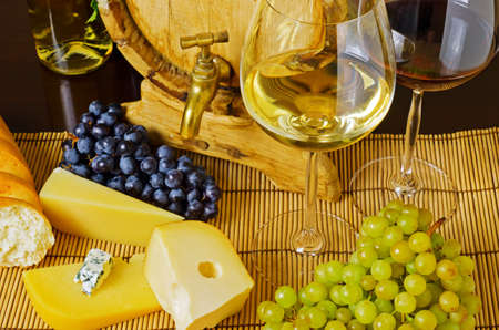Wine and cheese on the tableの写真素材