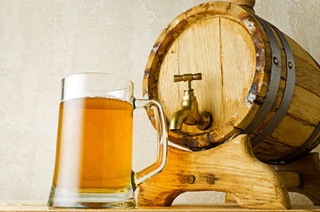 Beer and barrel on the wood table.の写真素材