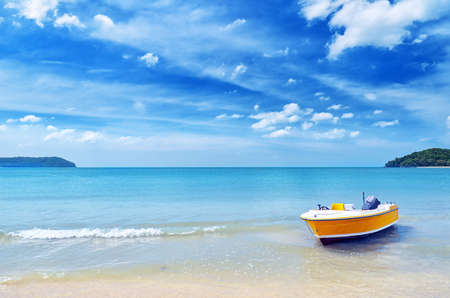 Yellow boat on a beach.の写真素材