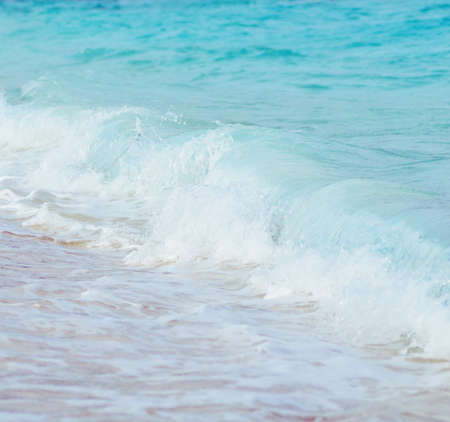 Blue wave on a beach  Shallow DOF の写真素材