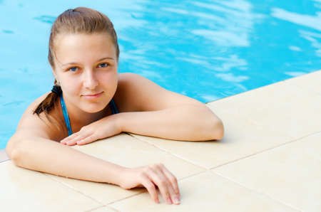 Young woman in a swimming pool の写真素材