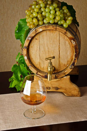 Glass of brandy on the table の写真素材