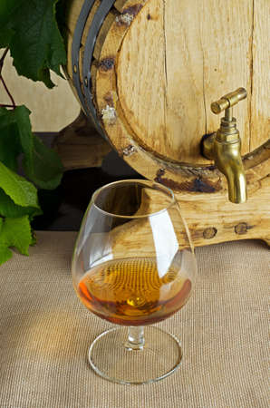 Glass of brandy on the table の写真素材