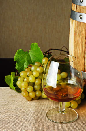 Glass of brandy on the table の写真素材