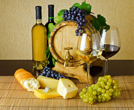 Wine and cheese on the tableの写真素材