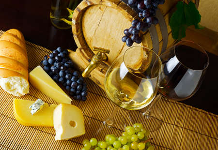 Wine and cheese on the tableの写真素材
