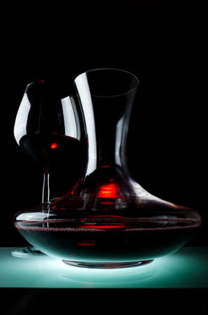 Decanting of red wine  Black background の写真素材