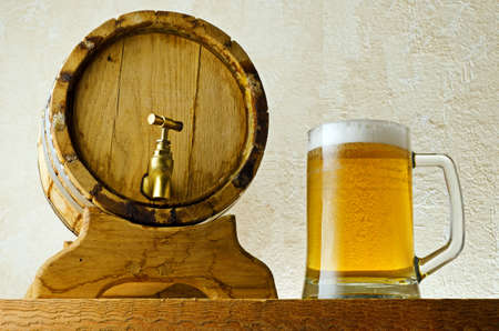 Beer and barrel on the wood table の写真素材