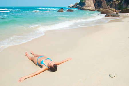 Young woman on the beach.の写真素材