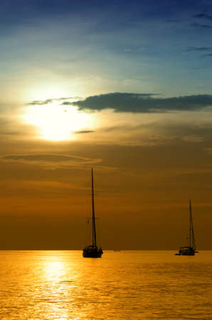 Sailboats at dusk  Tropical landscape の写真素材