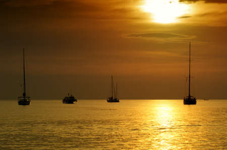 Sailboats at dusk  Tropical landscape の写真素材