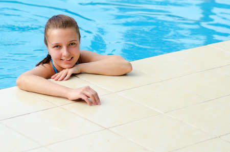 Young woman in a swimming pool の写真素材