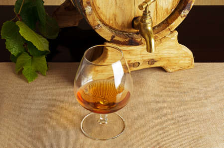 Glass of brandy on the table の写真素材