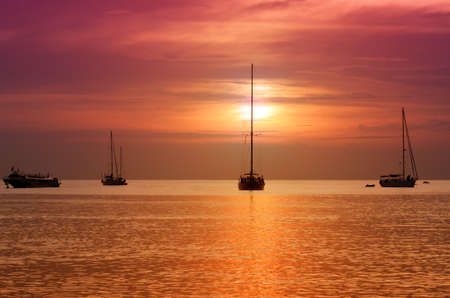 Sailboats at dusk. Tropical landscape.の写真素材