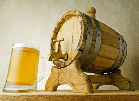 Beer and barrel on the wood table.の写真素材
