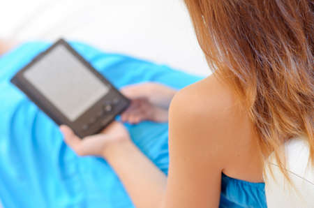 Woman with e-book in hands.の写真素材