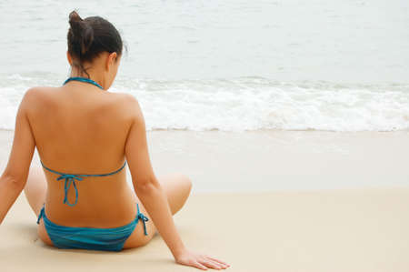 Beautiful young woman on the beach.の写真素材