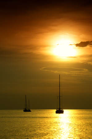 Sailboats at dusk  Tropical landscape の写真素材