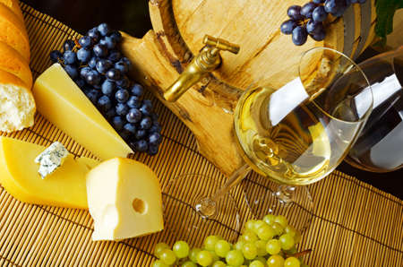 Wine and cheese on the tableの写真素材