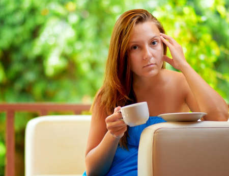 Young woman with cup of coffee.の写真素材