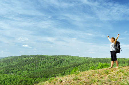Young hiker on the hilltop.の写真素材